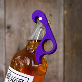 A strong magnet helps to catch the cap.  An excellent bottle opener to keep on your fridge.